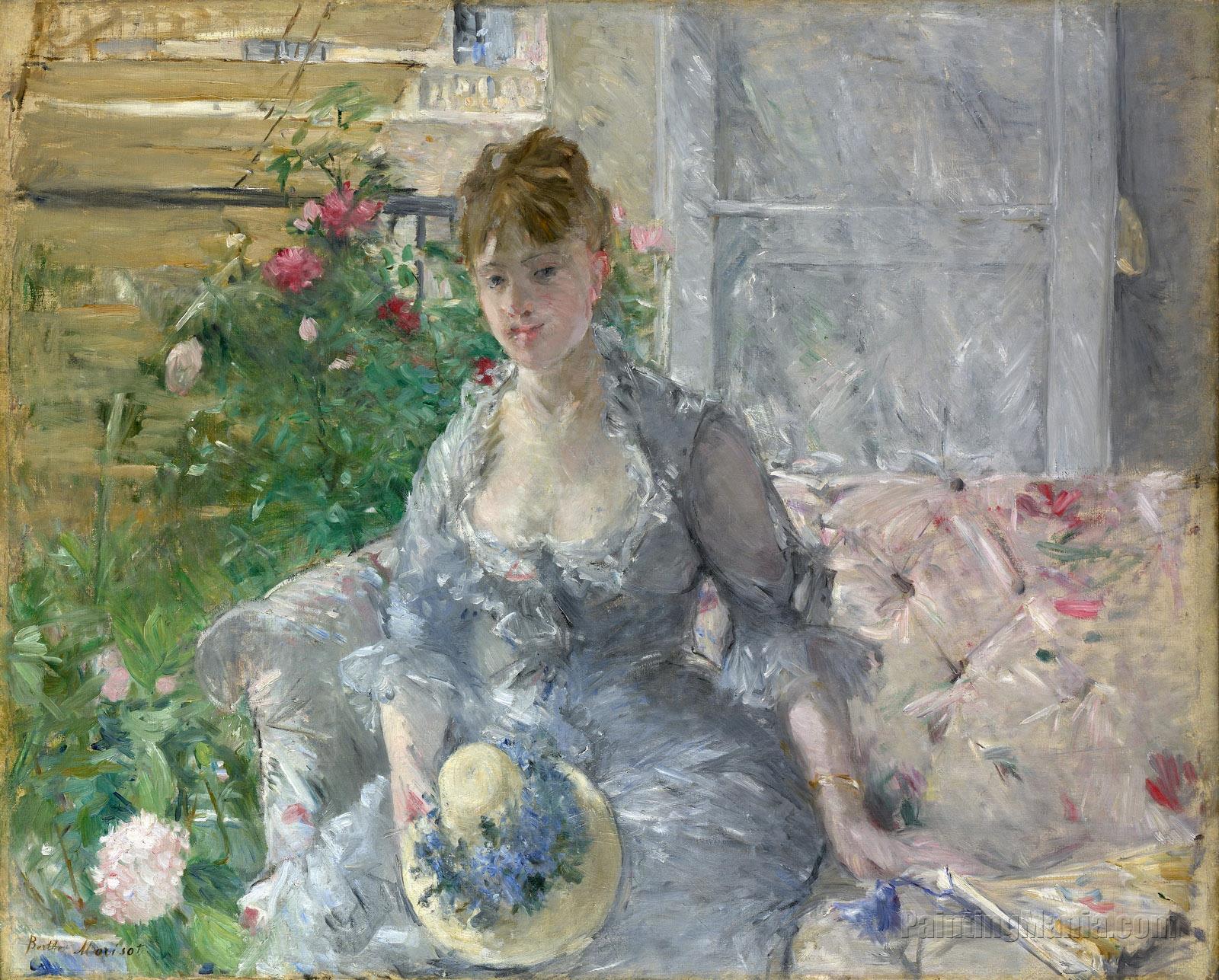 Young Woman Seated on a Sofa