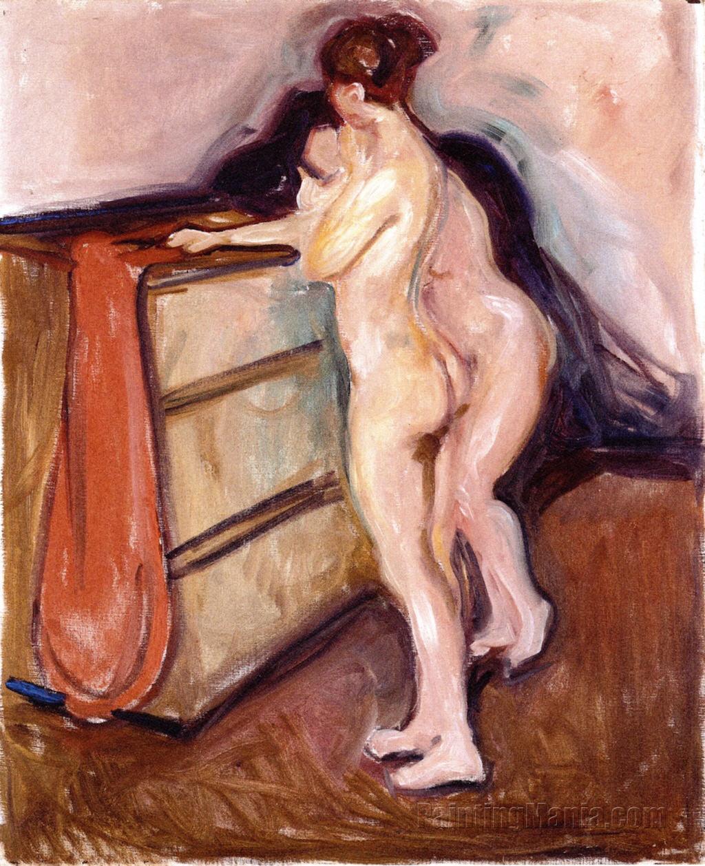 Two Nudes Standing by a Chest of Drawers