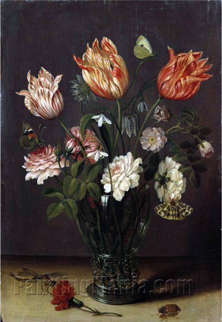 Tulips with Other Flowers in a Glass on a Table