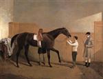 The racehorse 'Lady Emily' with jockey Delme Radcliffe. groom and stable boy