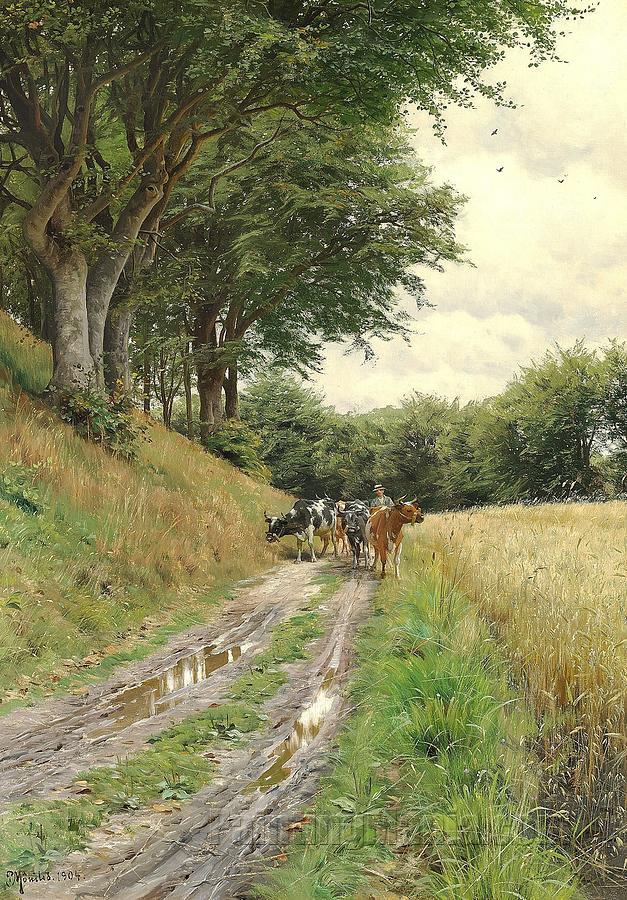 A farmer herding his cows along a path at the edge of a wood